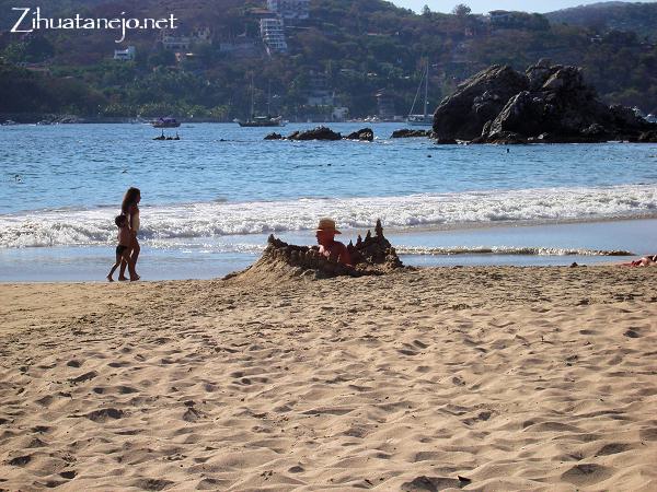 Man in sandcastle at Playa La Ropa